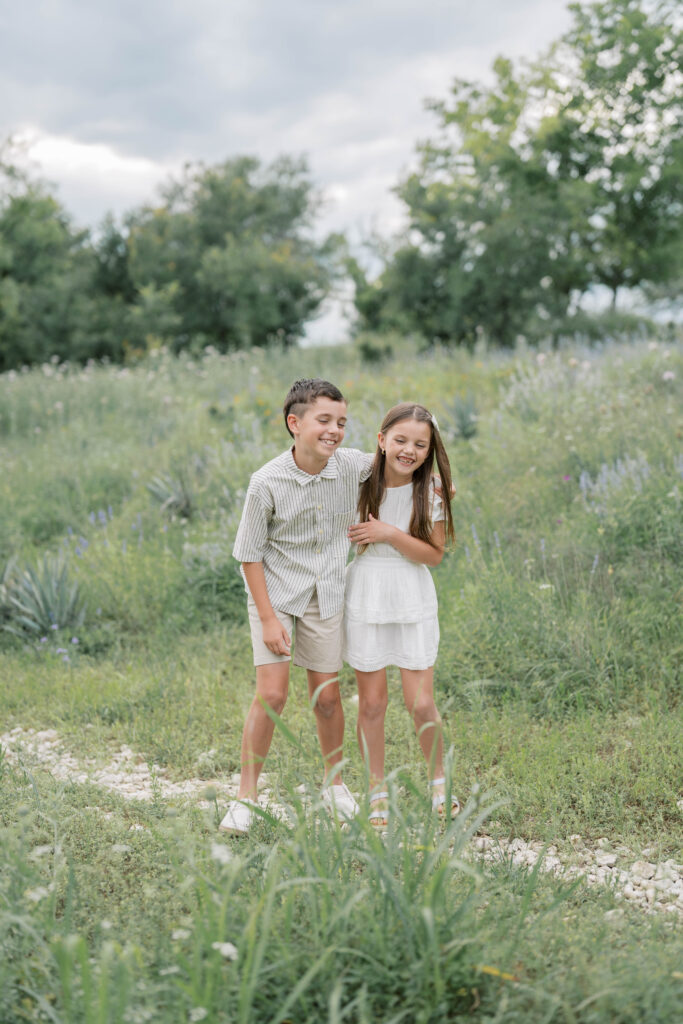 brother and sister laughing for spring family photos