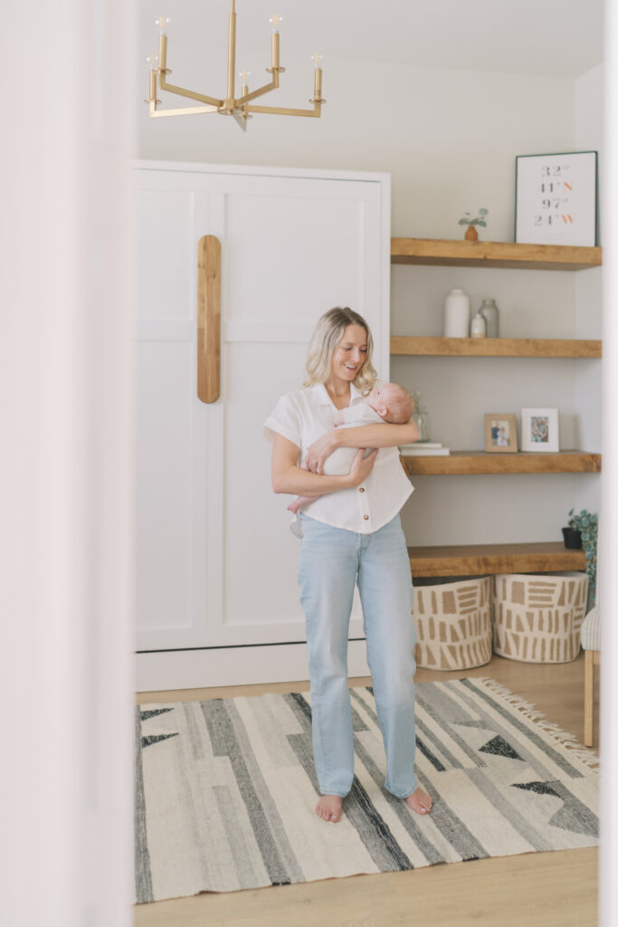 mom standing with newborn