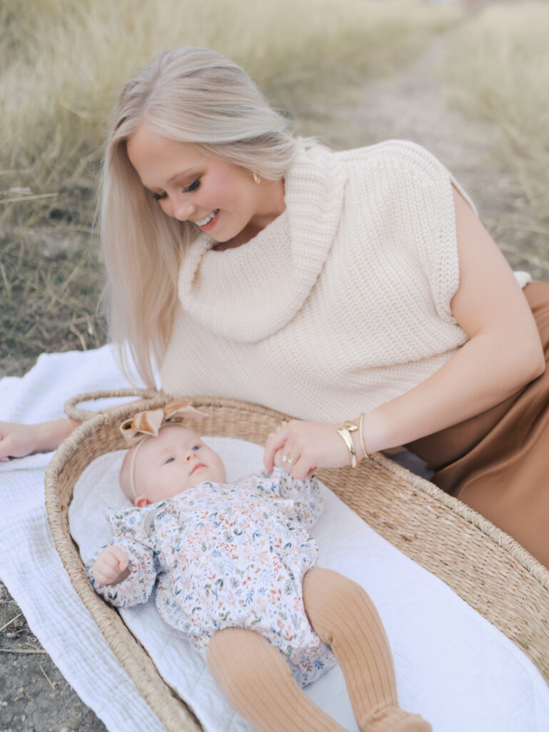 mom with newborn baby outside at a newborn photography colorado springs session