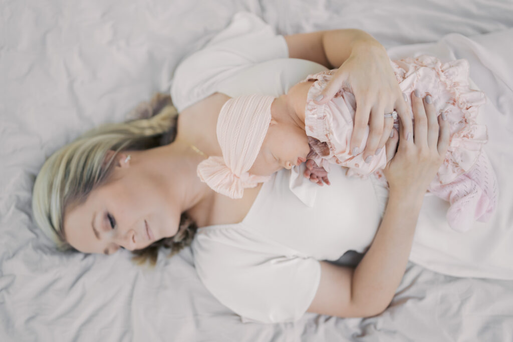mom laying with baby on chest for Colorado Springs Outdoor Newborn Session