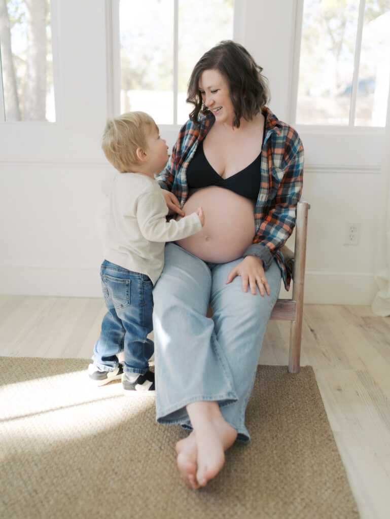 expecting mom looking at young child for Maternity Photography Colorado Springs | Lauren Bounds Photography