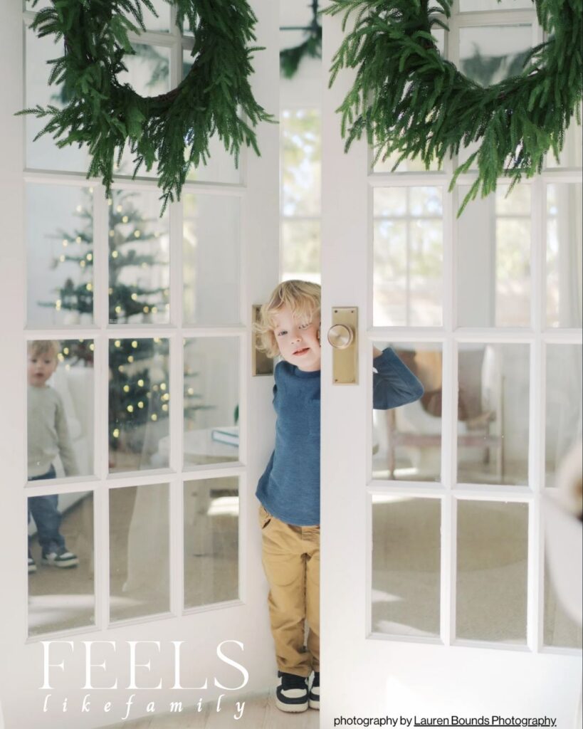boy standing in doorway taken by Featured Colorado Springs Family Photographer