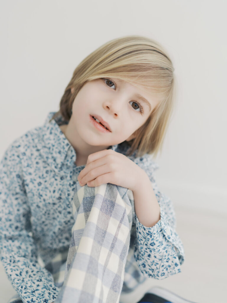 boy sitting with knee up and hand resting on knee for Colorado Springs Personality Sessions