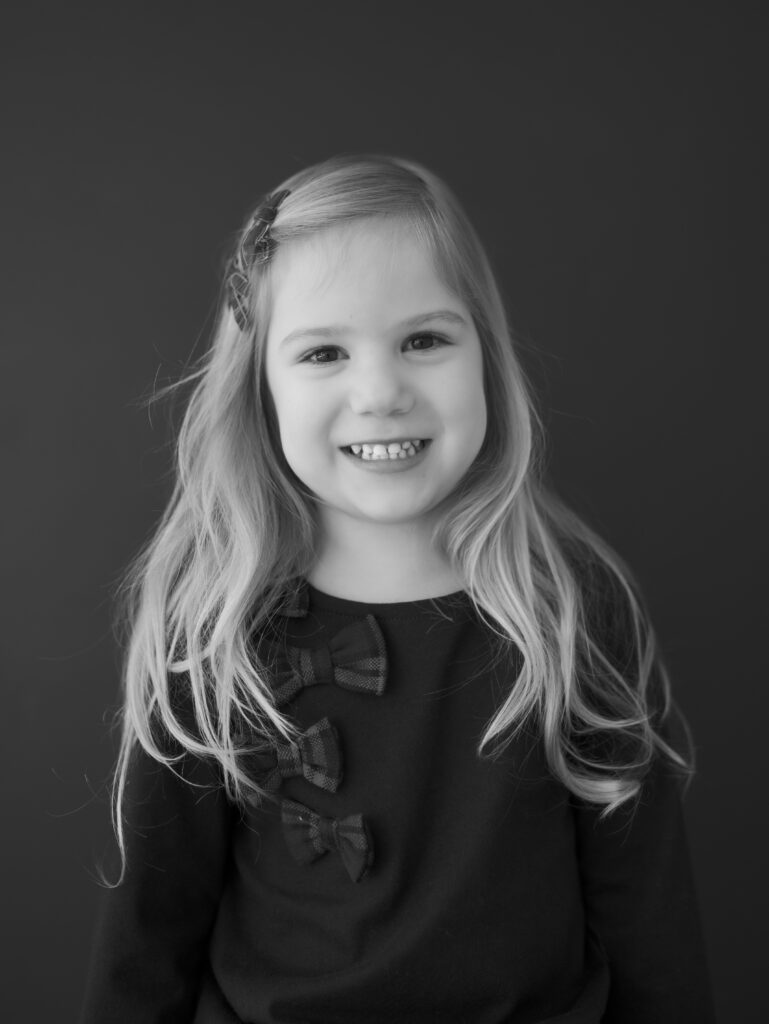 young girl in front of black backdrop for Kid headshots, Lauren Bounds Photography in Colorado Springs, CO