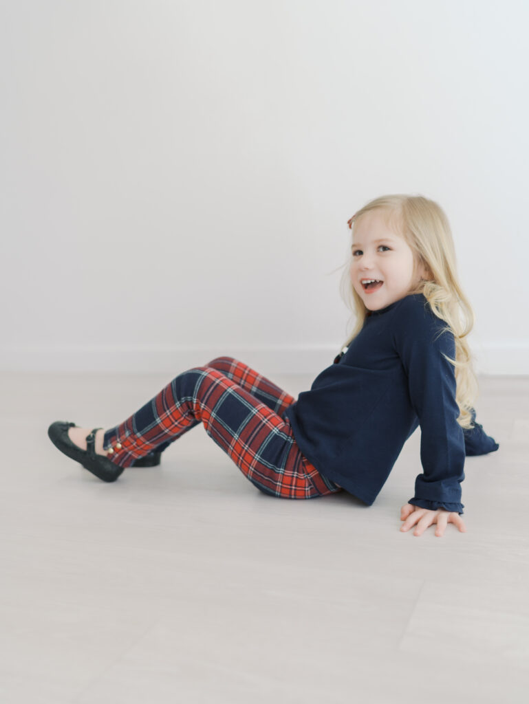 girl sitting with hands behind sming for Colorado Springs Personality mini Sessions