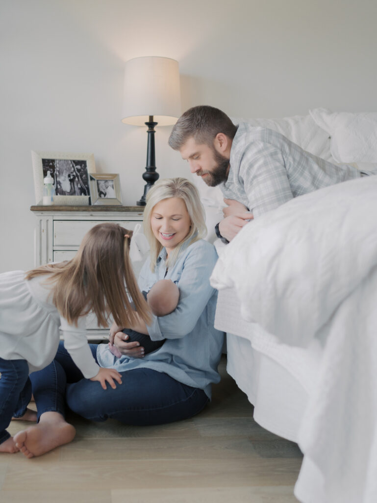 Family admiring newborn, Colorado Springs Newborn Photographer