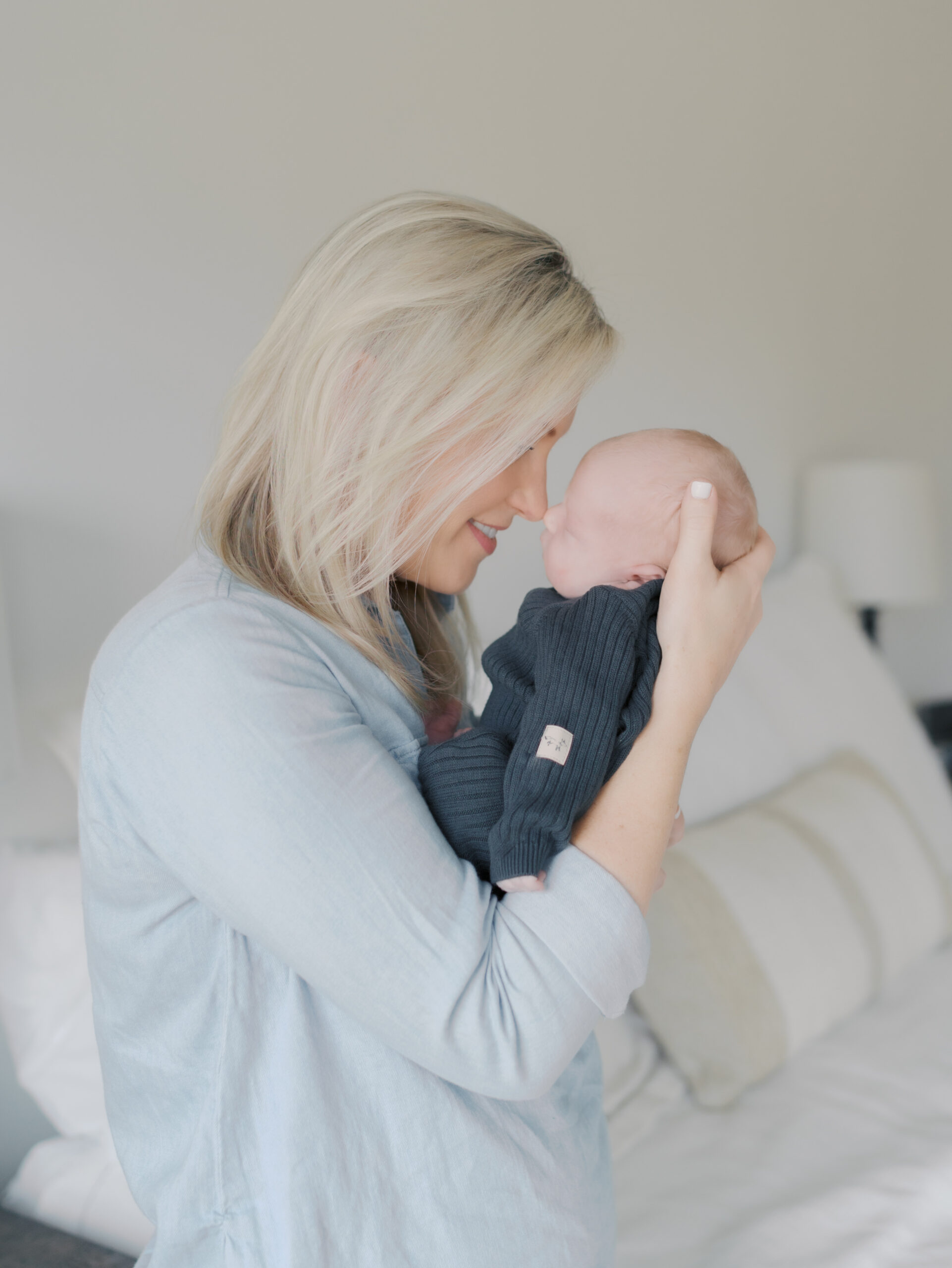 mom nose to nose with newborn baby
