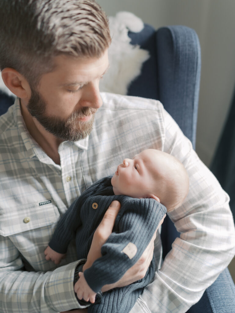 dad with newborn baby for Take better photos at home | Colorado Springs Newborn Photographer