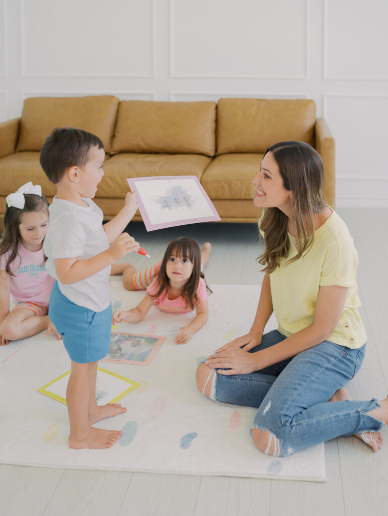 boy showing mom is water color painting get in more photos with your kids by Colorado Springs Brand Photographer