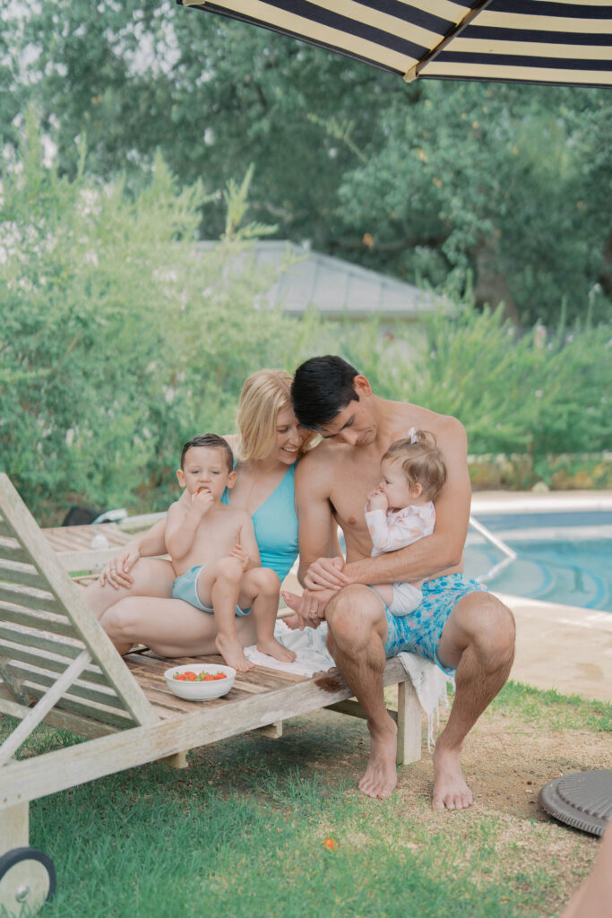 family of four sitting poolside enjoying a snack for Photography Colorado Springs
