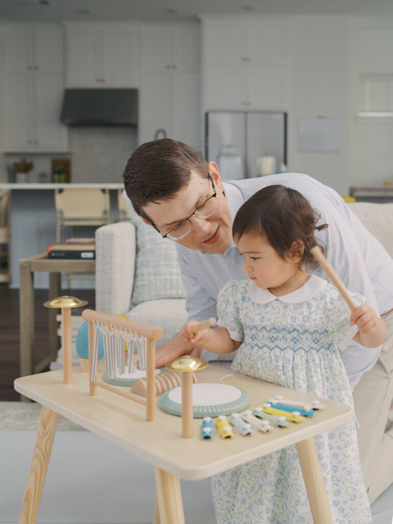 Dad playing with toddler