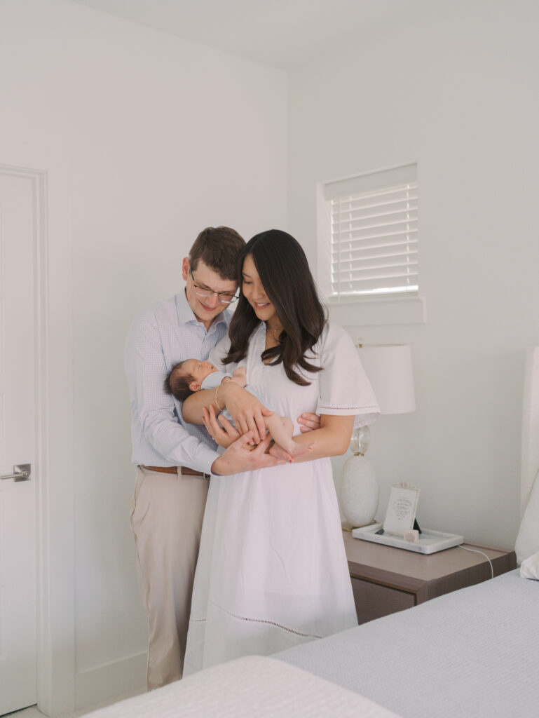 Mom and dad looking at baby