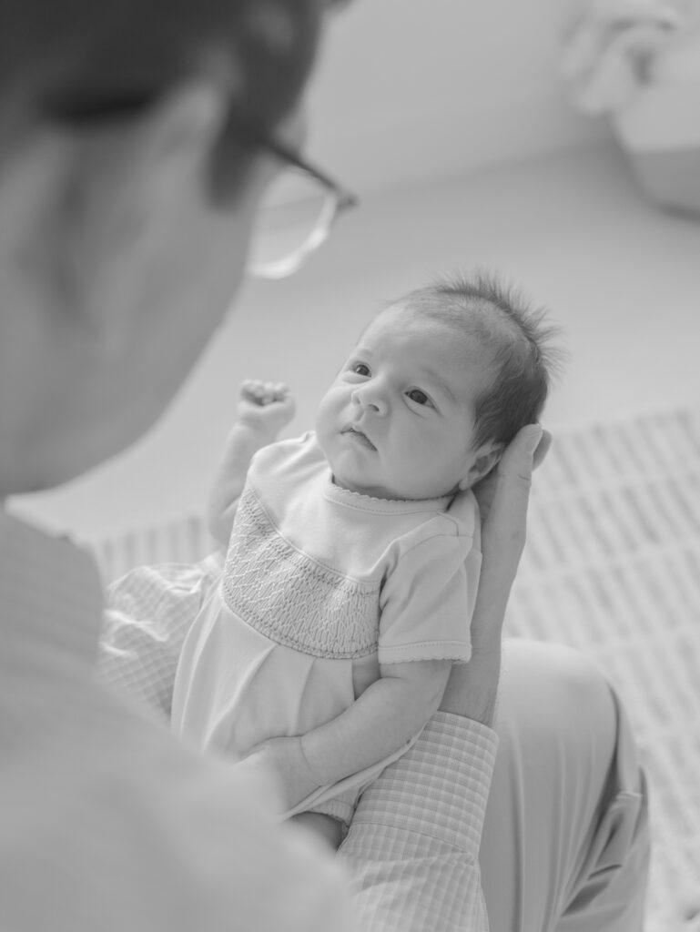 Dad looking at baby by Colorado Spring Maternity Photographer