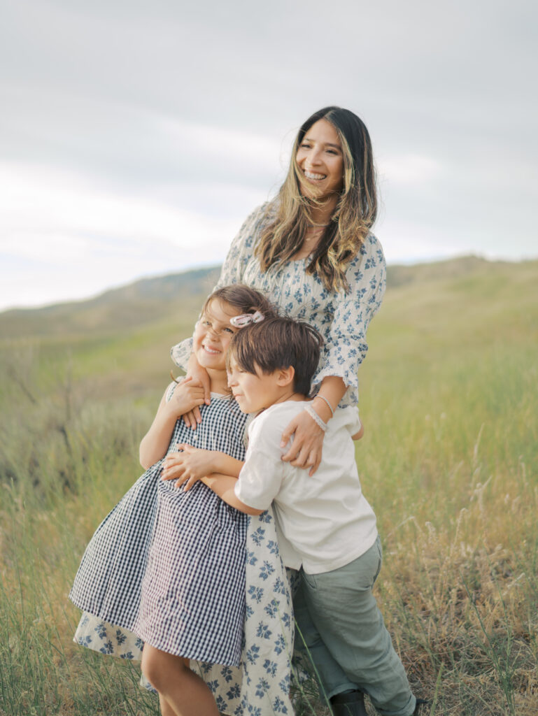 Mom hugging kids smiling big-Family Adventure Photo Sessions by Lauren Bounds Photography