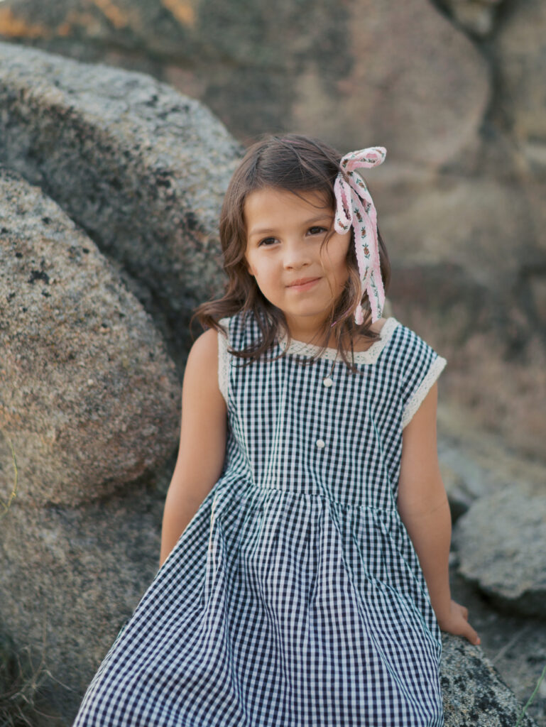 girl sitting on rock 
