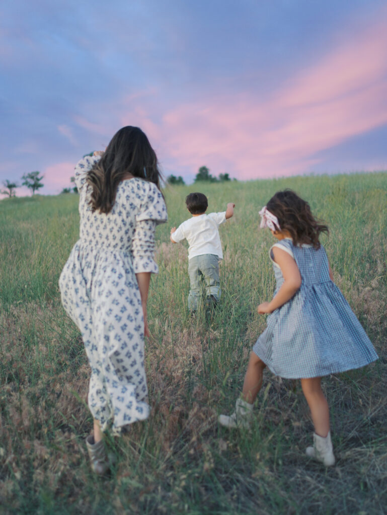 Mom and Kids running up a hill captured by Lauren Bounds- Family Photos Colorado Springs