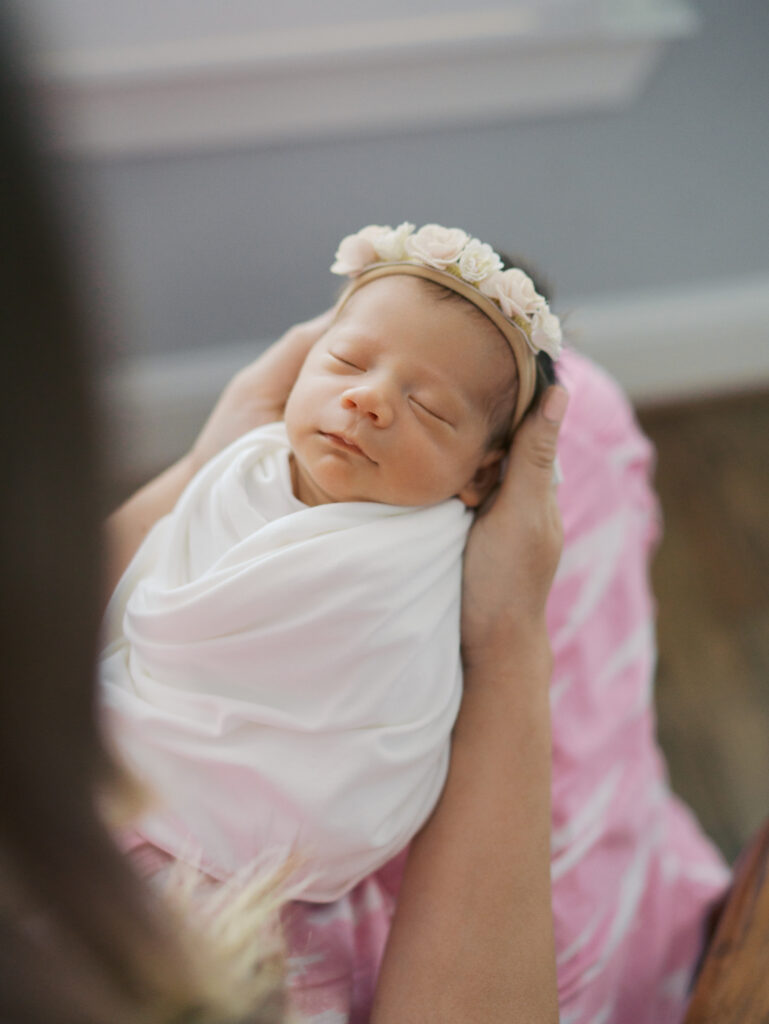 Swaddled newborn baby in mom's arms taken by | Colorado Springs Newborn Photography | Lauren Bounds Photography