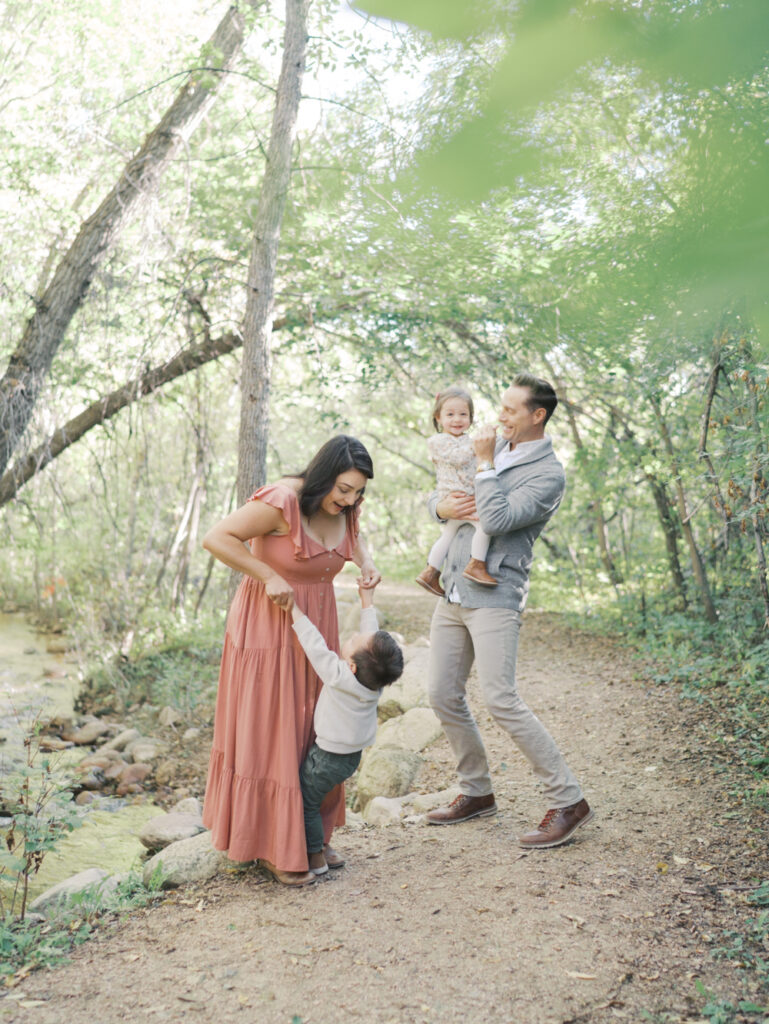 family dancing at Bear Creek Nature Center during a Colorado Springs Family Photo session 