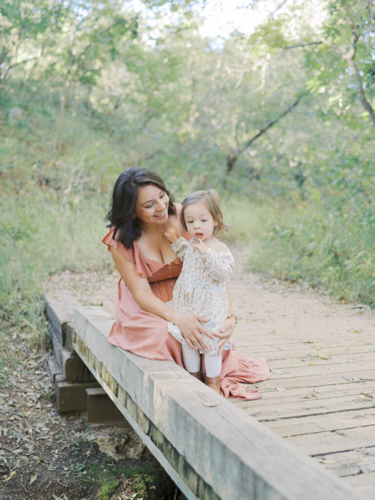 mom with toddler daughter at Bear Creek Nature Center during a Colorado Springs Family Photo session 