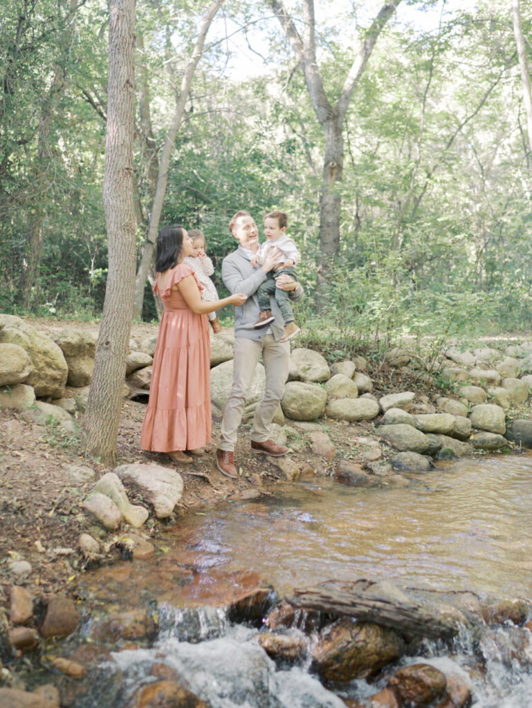 Family by the creek at Colorado Springs Family Photo session at Bear Creek Nature Center Taken by Lauren Bounds Photography