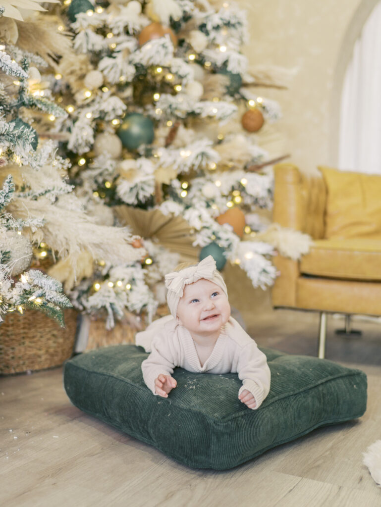 baby with christmas tree at a photo studio in Colorado Springs