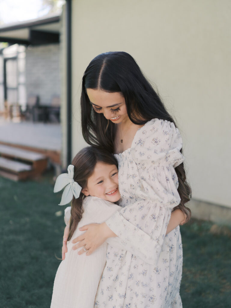 mom and daughter hugging