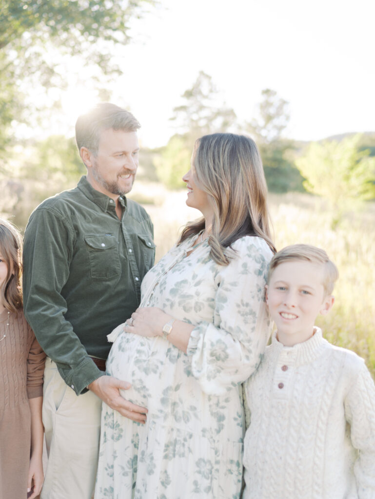 Colorado Springs Maternity Photographer captures loving couple embracing