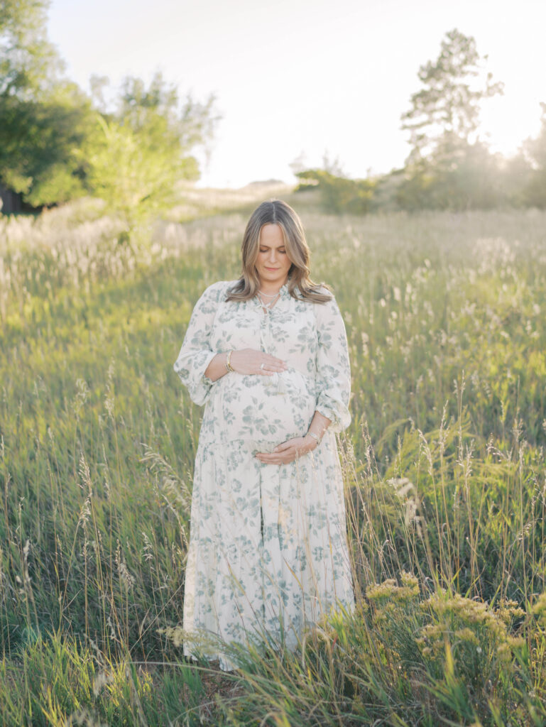 Beautiful mom gazing at belly during a Colorado Springs Maternity Photographer with Lauren Bounds Photography