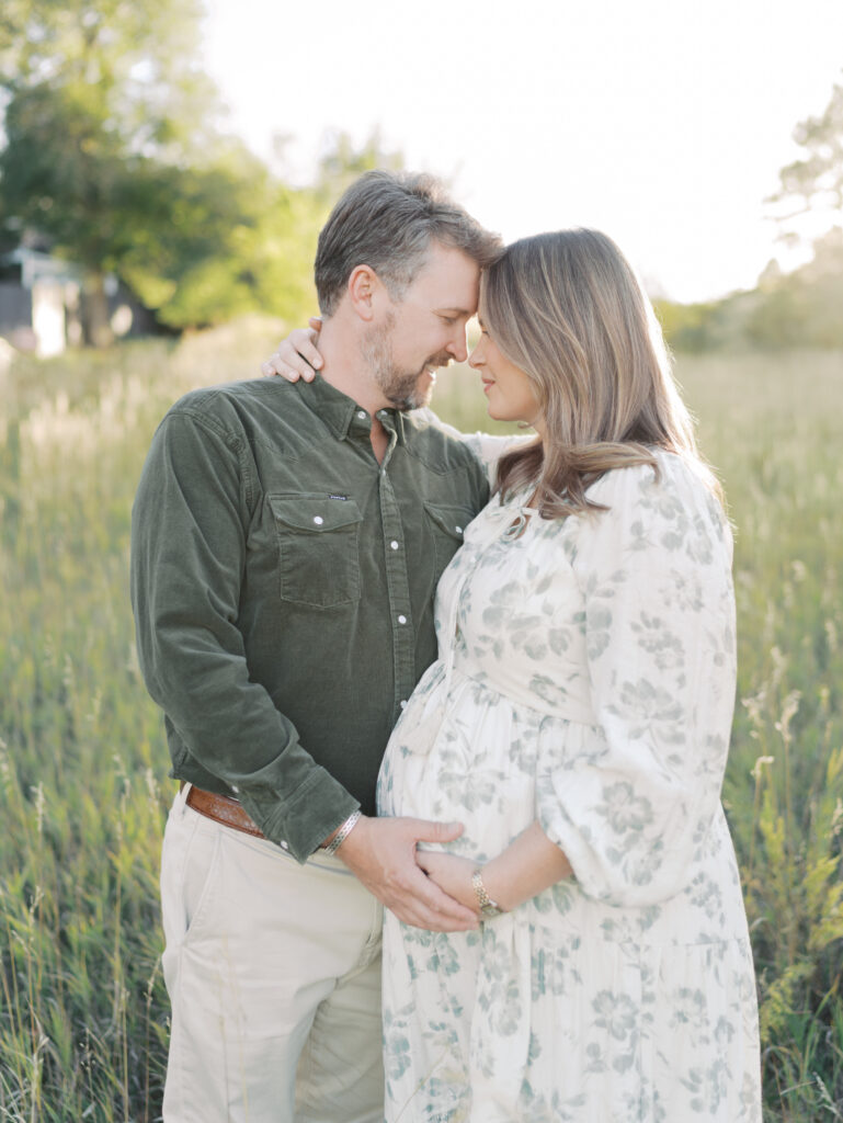 couple embracing with heads close facing each other