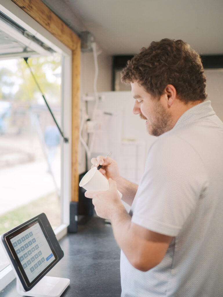 Zac getting a coffee order at the Best Coffee Colorado Springs Good Gracious Coffee Trailer