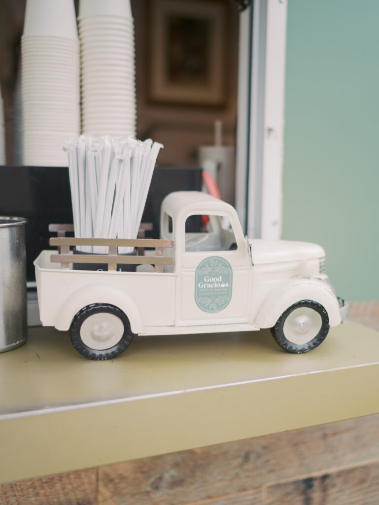 Little truck holding straw at the Best Coffee Colorado Springs Good Gracious Coffee Trailer