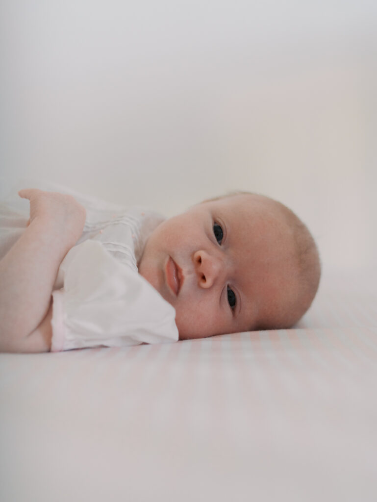 baby infant laying on back