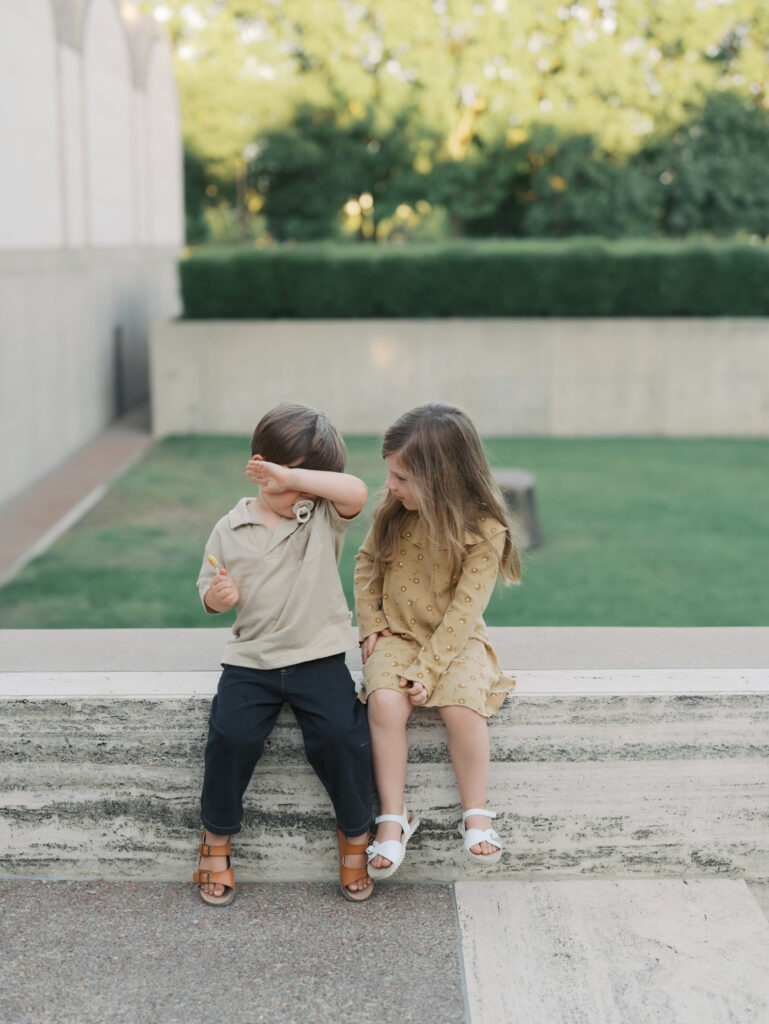 siblings comforting each other while sitting on a bench for Colorado Springs Pictures