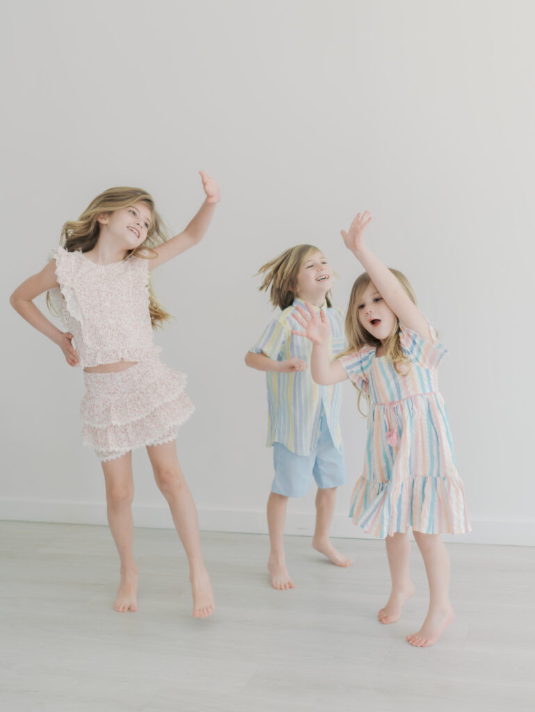 three kids dancing for sibling mini sessions colorado springs