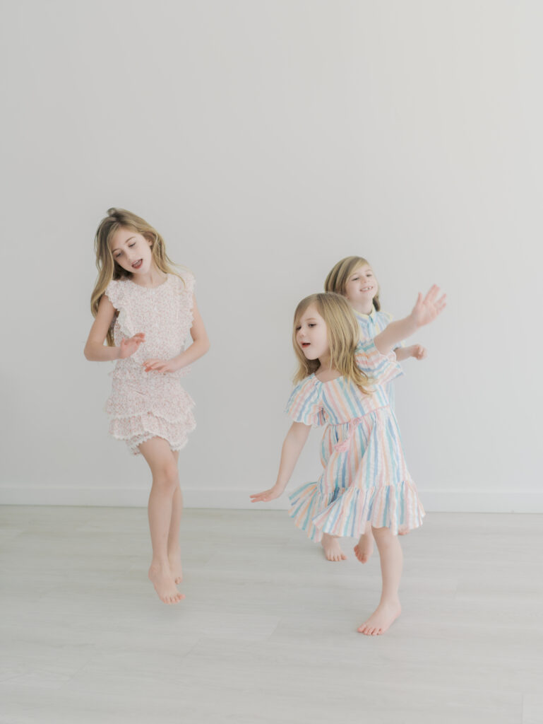 three siblings dancing for sibling mini sessions colorado springs