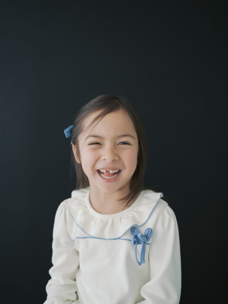 girl smiling in studio for Kid Personality Photos Colorado Springs