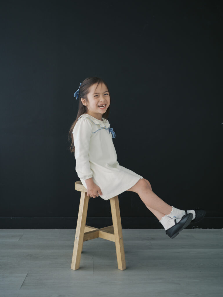 girl laughing turned sideways for Kid Personality Photos Colorado Springs