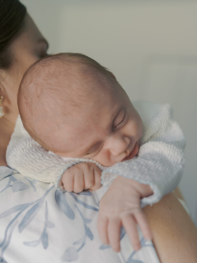 close up of baby on moms shoulder