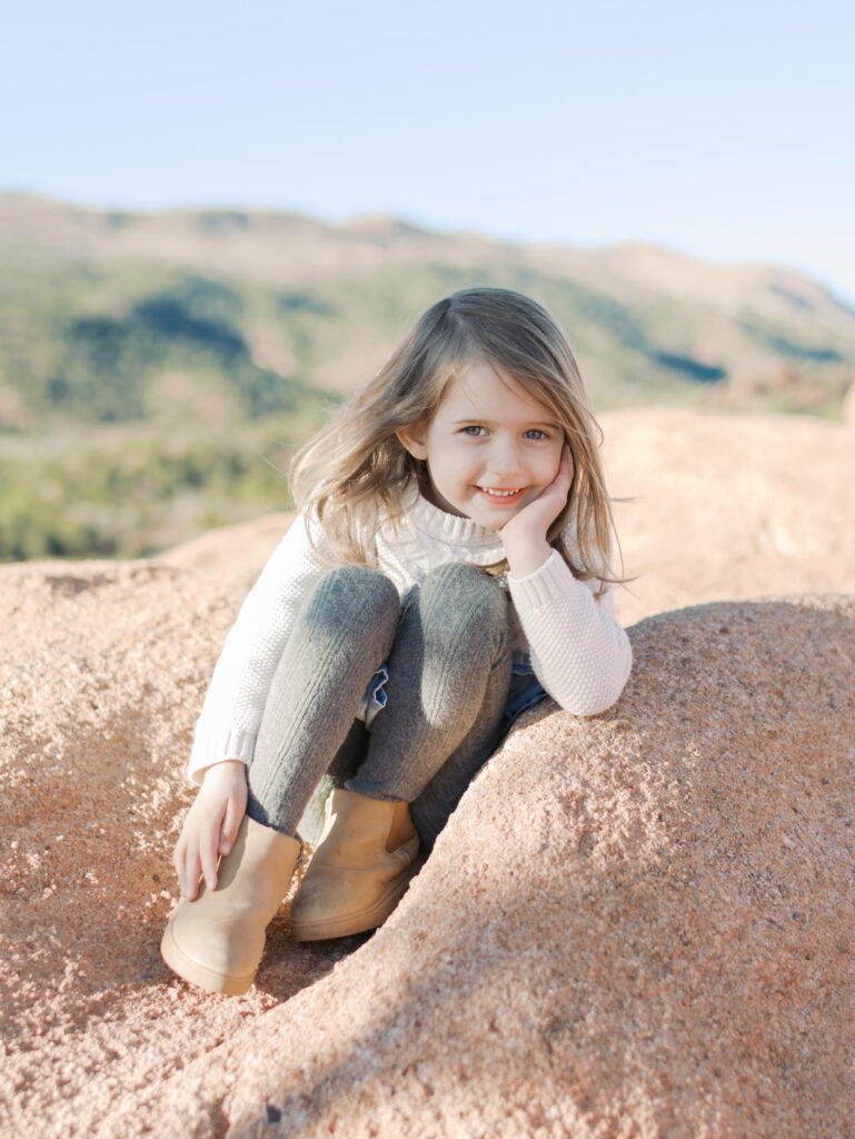 little girl at Garden of the Gods taking  Photos