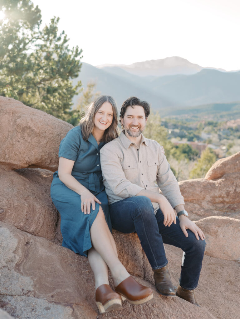 parents sitting at garden of the gods during colorado springs family photo session