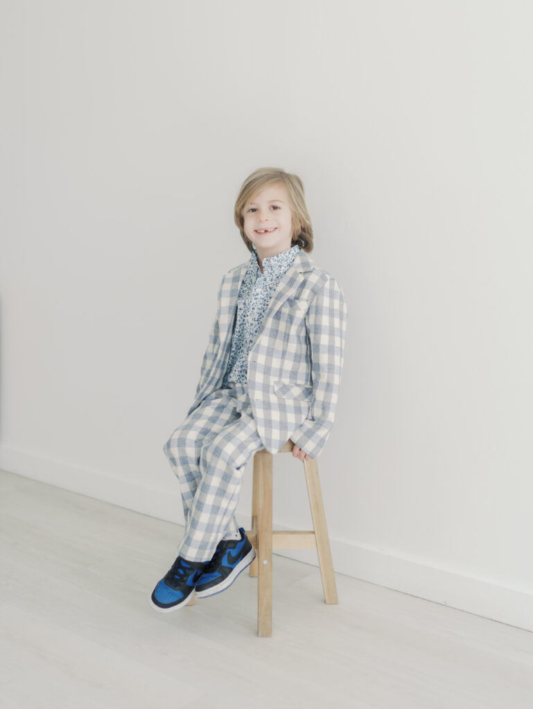 boy sitting on stool in studio in colorado springs