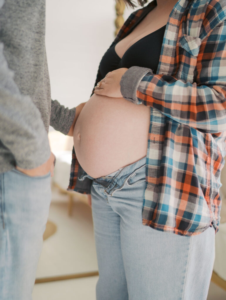 close up of moms pregnant belly