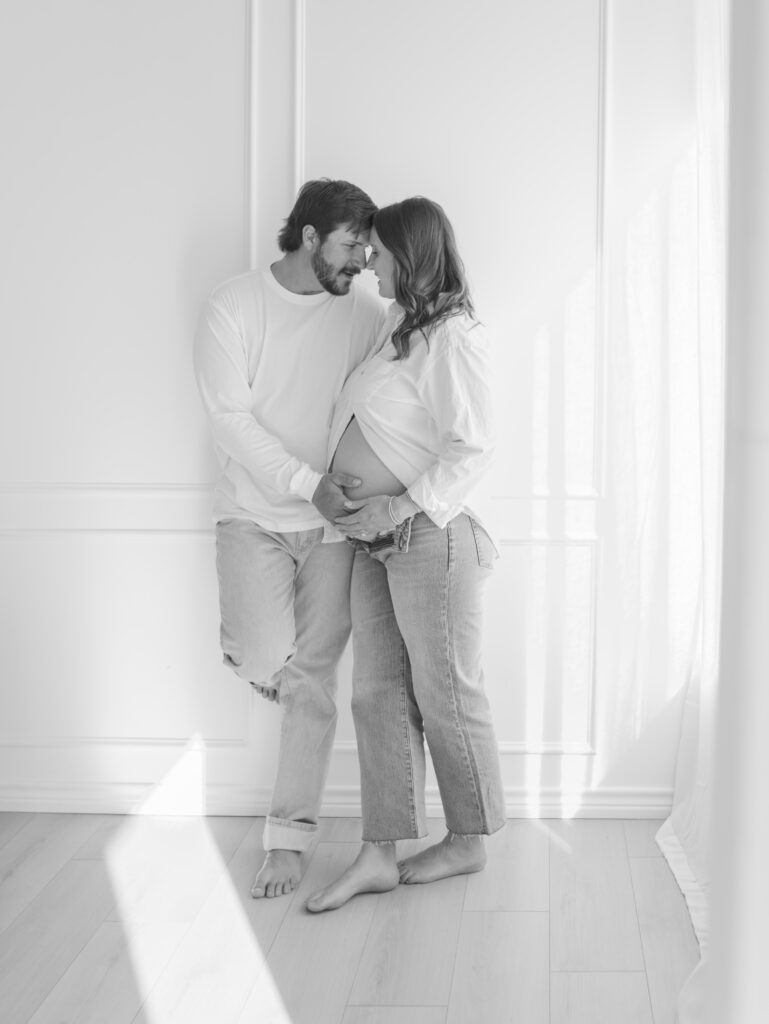 couple leaning against wall 