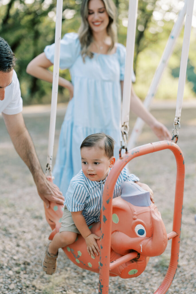little boy on elephant swing