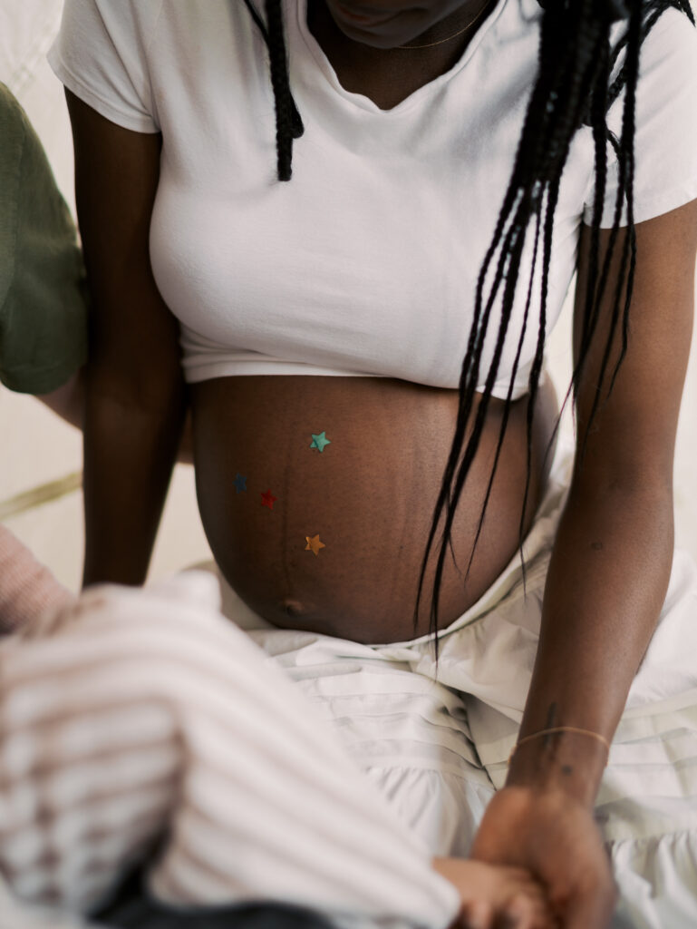 expecting moms stomach with star stickers for Studio Maternity Photos Denver by Lauren Bounds Photography