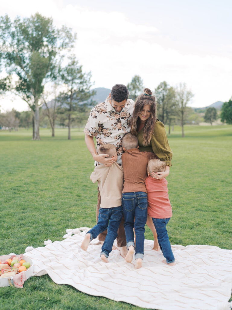 Family of five hugging for colorado springs colorado photographers family photo session