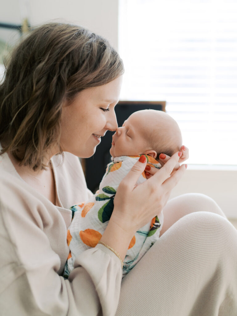 mom nose to nose with newborn in arms for Colorado Springs Newborn Photography