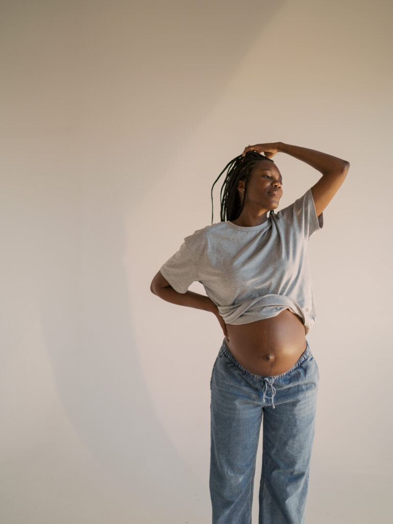 expecting mom in studio taking picture for colorado maternity photography guide with Lauren Bounds Photography