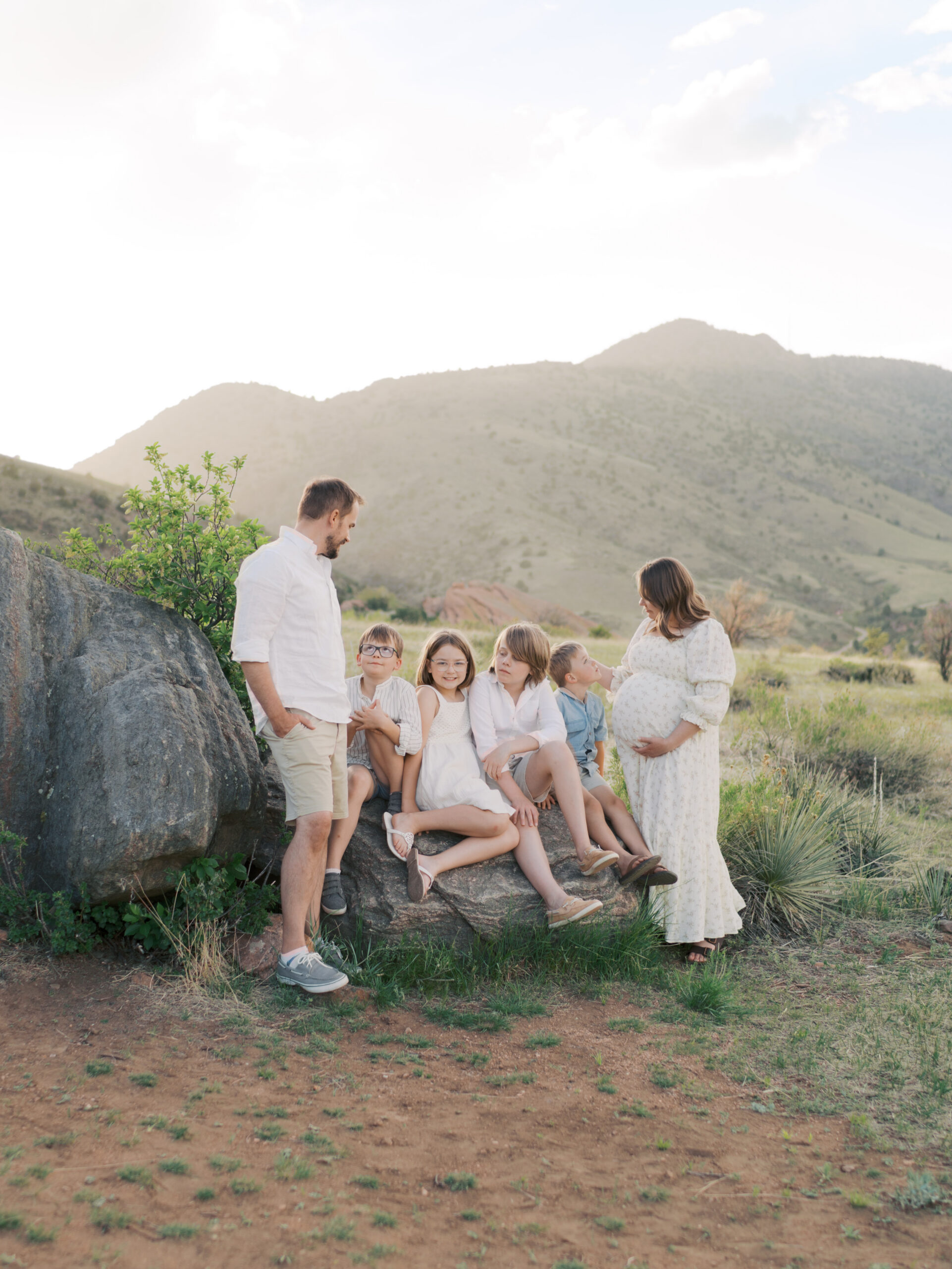 Family of 6 on rock in denver, co for maternity photos