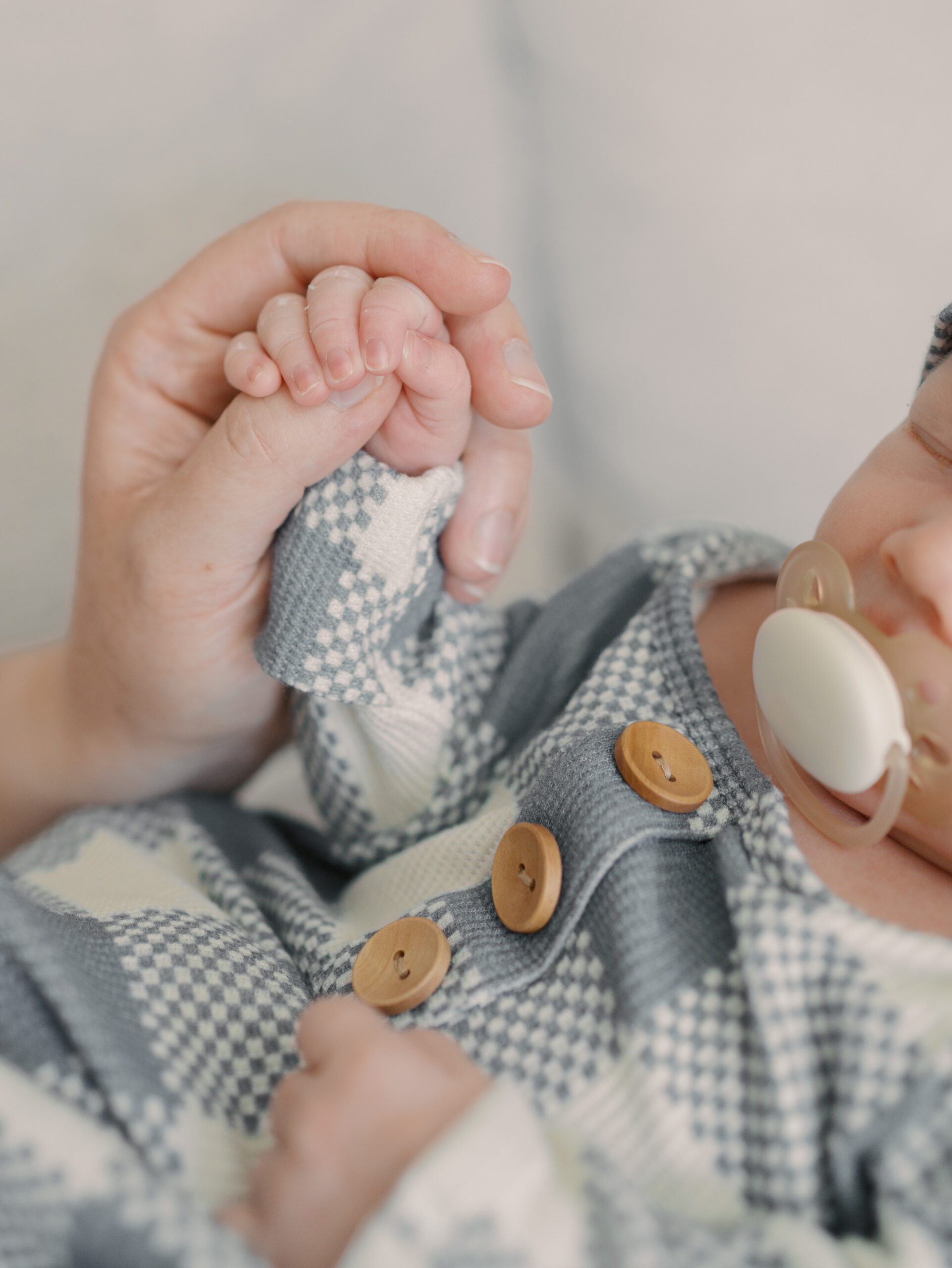Newborn hand wrapped in moms for Colorado Springs Newborn photos